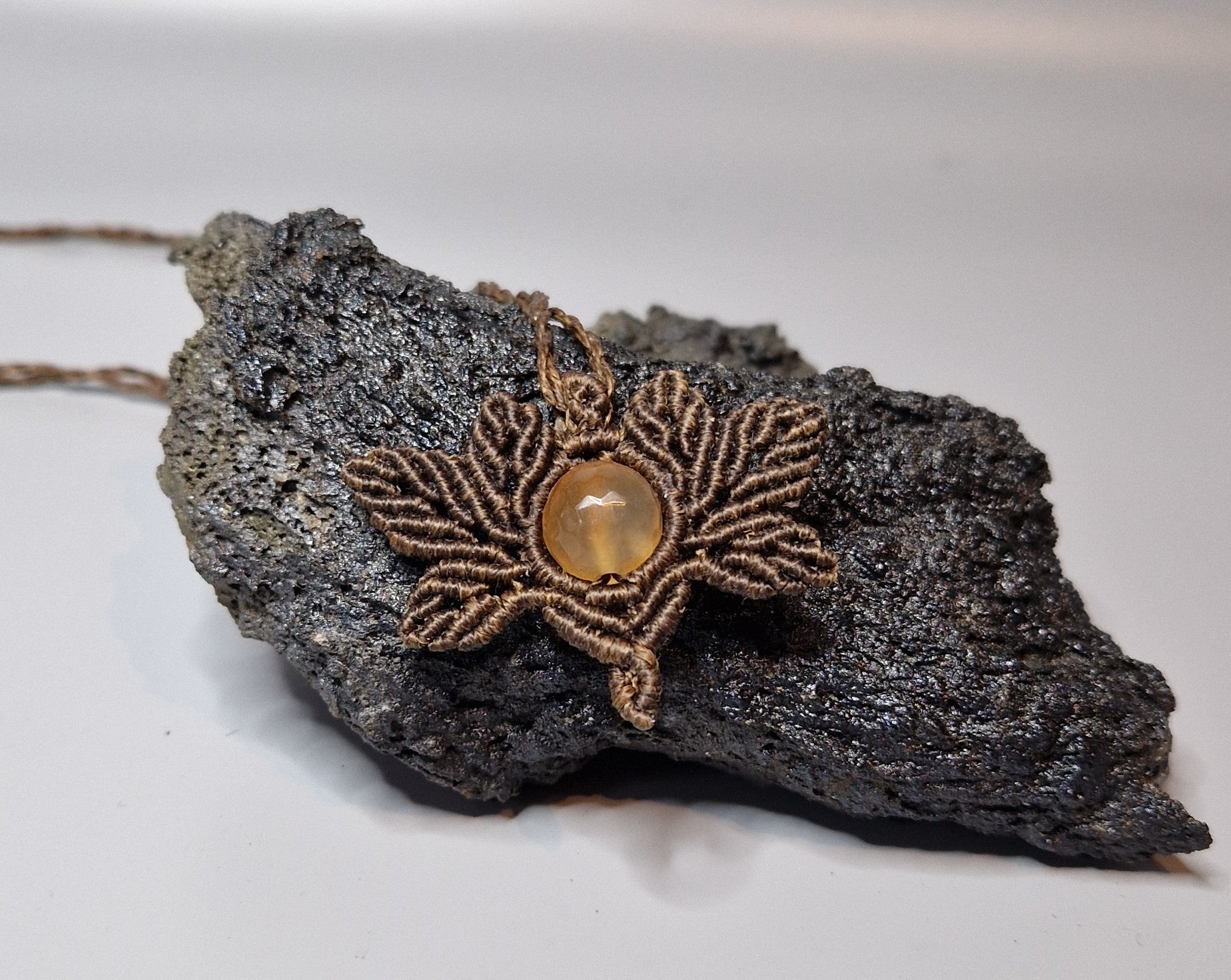 Jewelry with a stone on a piece of dark rock