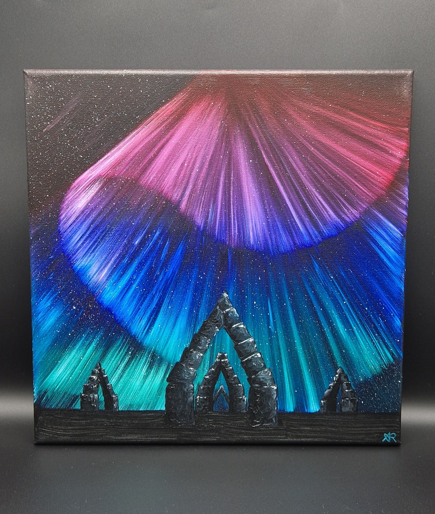 Painting with northern lights artwork.