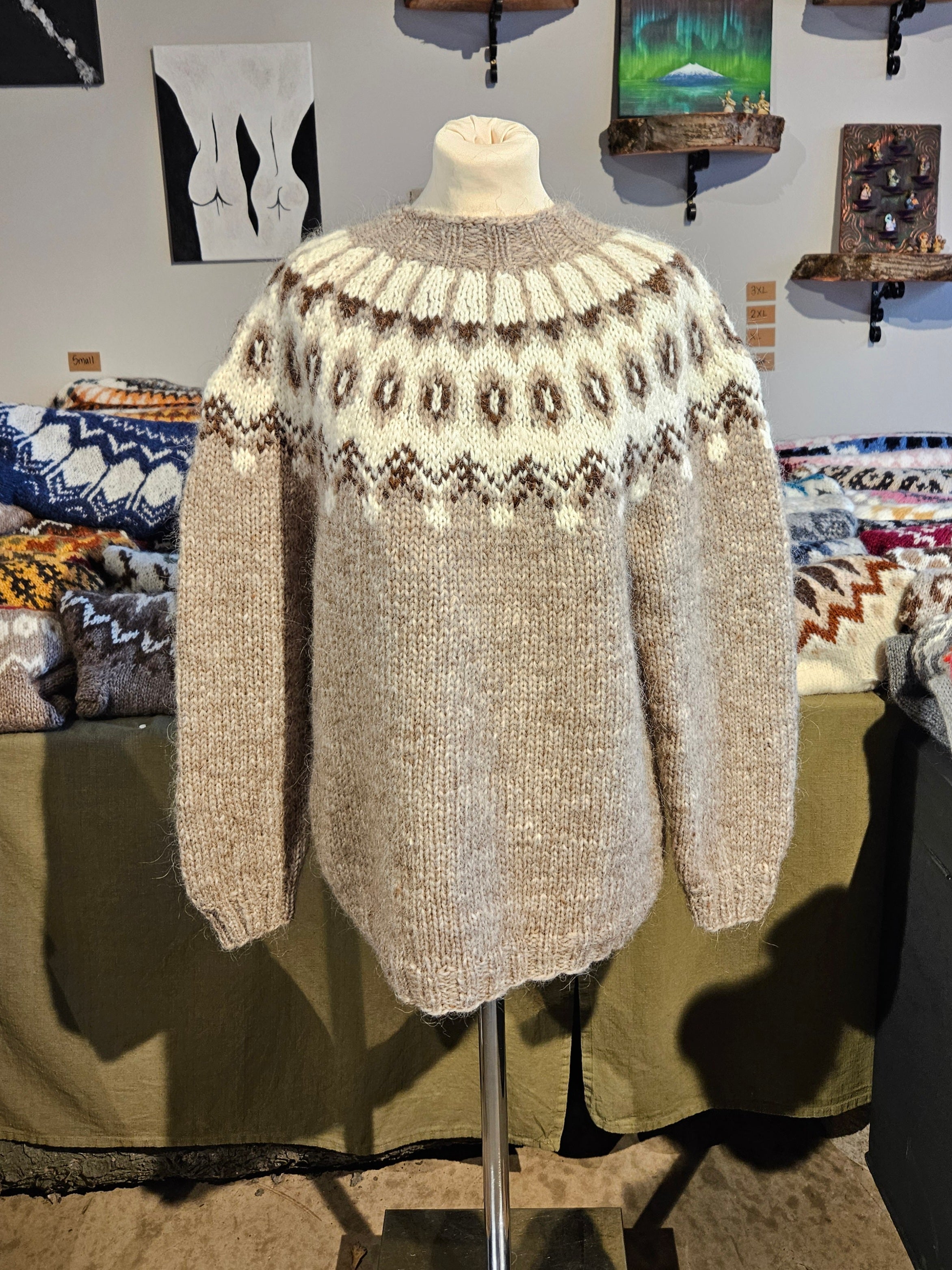 Knitted sweater on a mannequin in a store setting with various items in the background