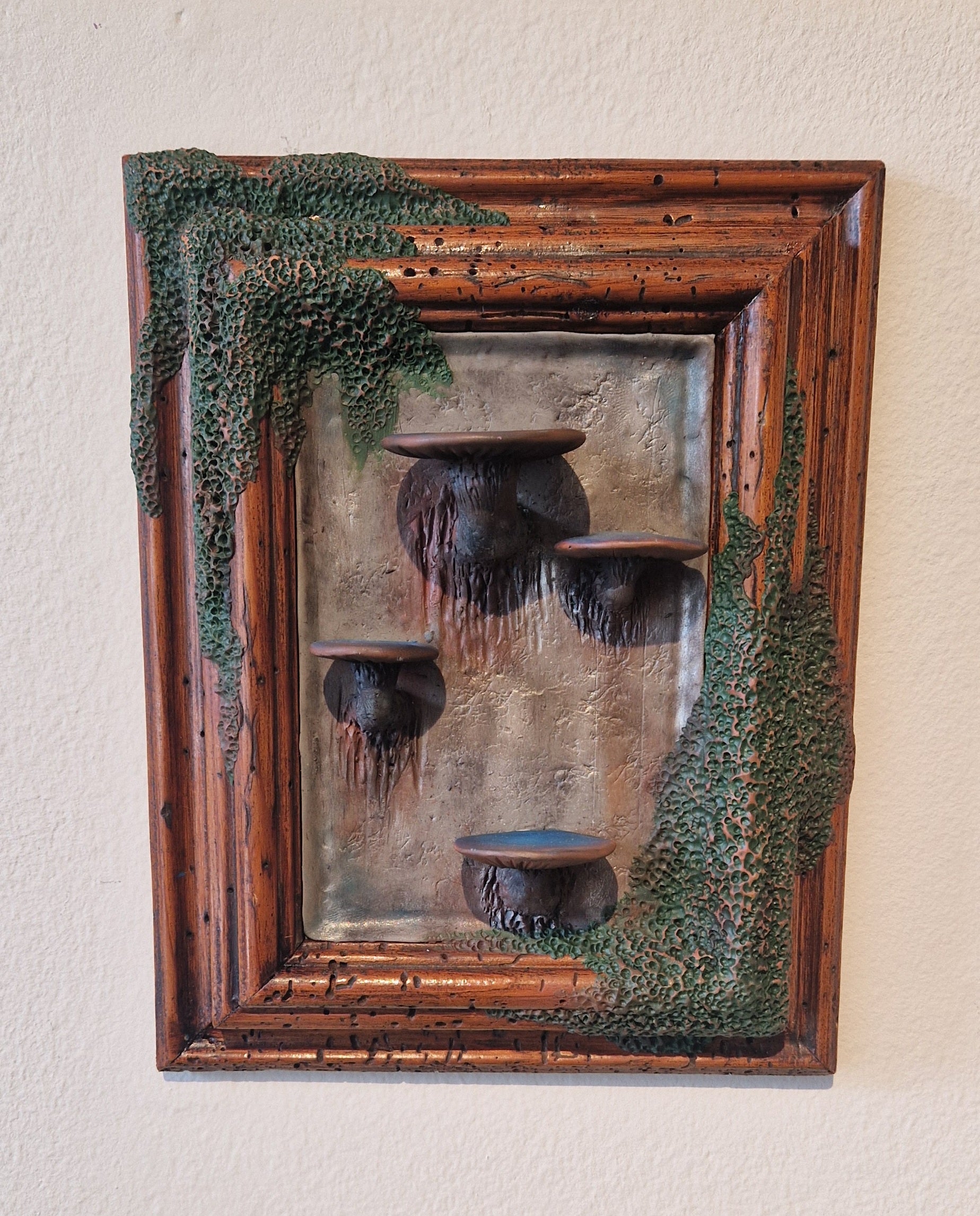 Mossy frame with mushroom shelves by Jódís Eva