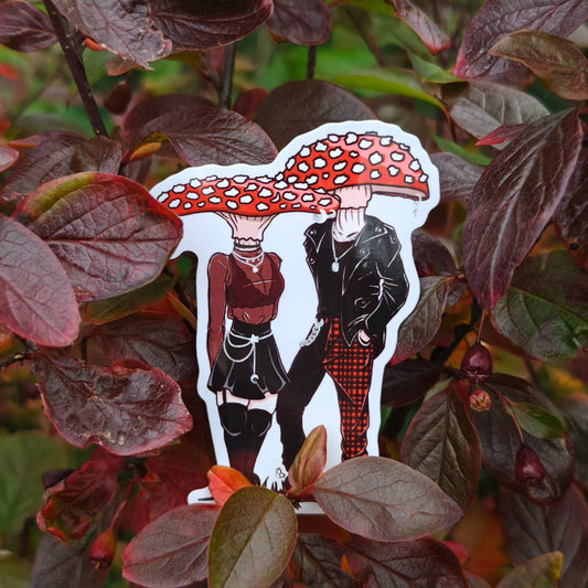 A decorative sticker depicting a cartoonish character with a large mushroom head, placed against a backdrop of red leaves.
