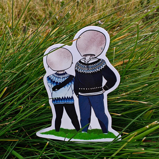 A decorative sticker depicting a cartoonish character in icelandic wool sweaters with a large mushroom head, placed against a backdrop of green grass.